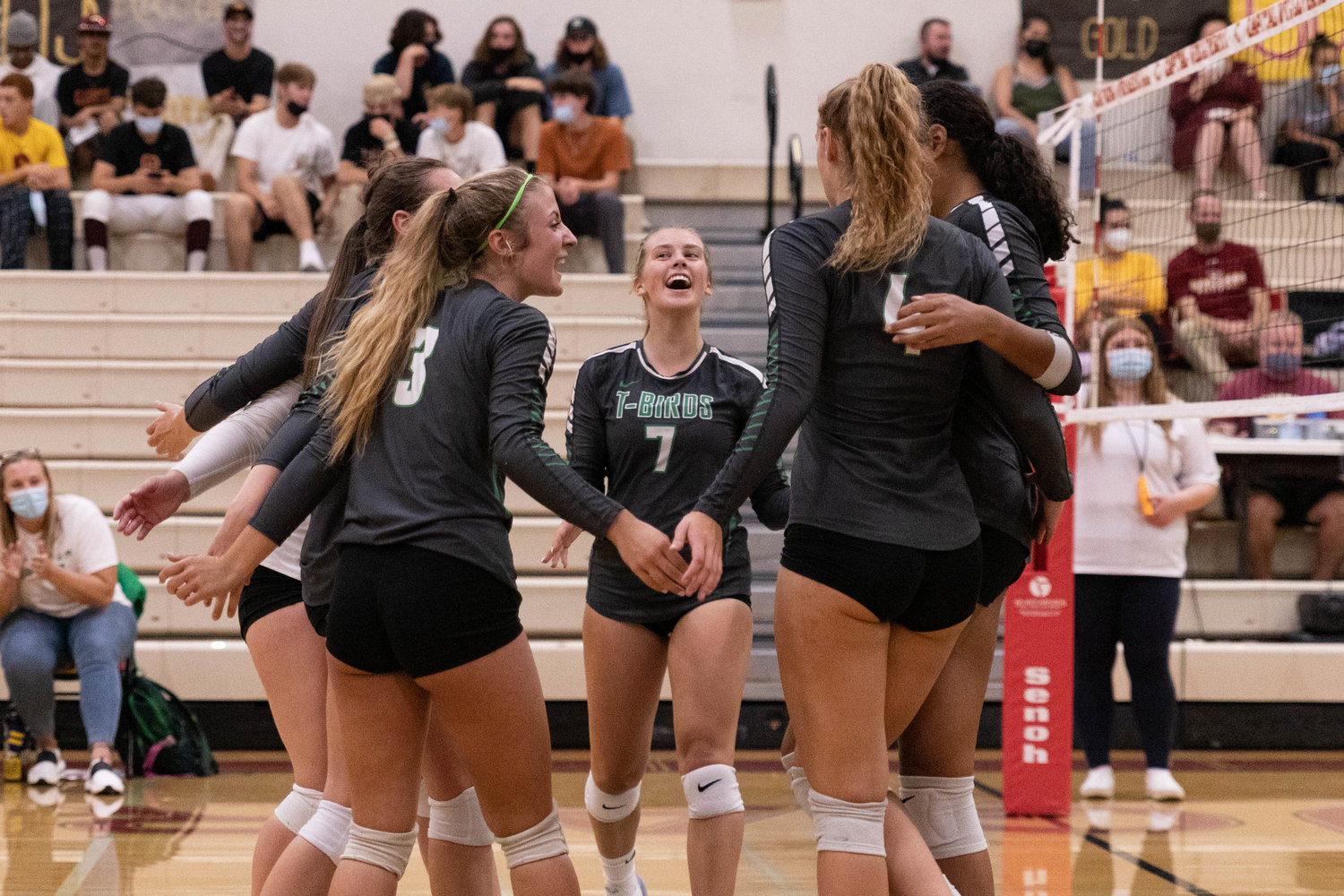 The Tumwater volleyball team celebrates a point in the first set of its sweep over Capital Tuesday night.