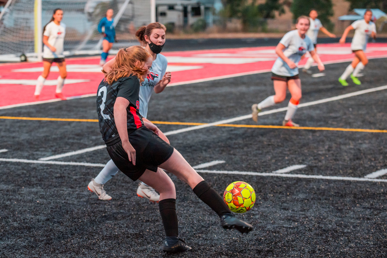 Tenino’s Abby Severse (2) kicks the ball down field Tuesday night at Beaver Stadium during a game against Centralia.