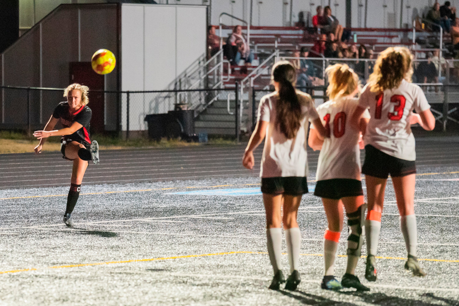 Tenino attempts to score during a free kick at Beaver Stadium as Centralia defends their goal with a wall Tuesday night.