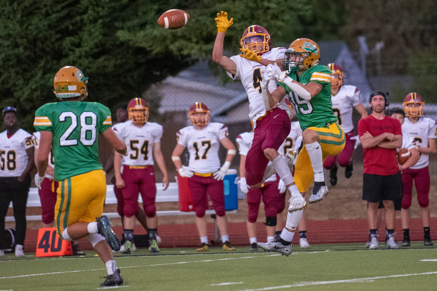 Tumwater's Ashton Paine (15) breaks up a pass intended for Capital wideout Deonte Burns (4) on Thursday, leading to Ryan Orr's (28) interception.