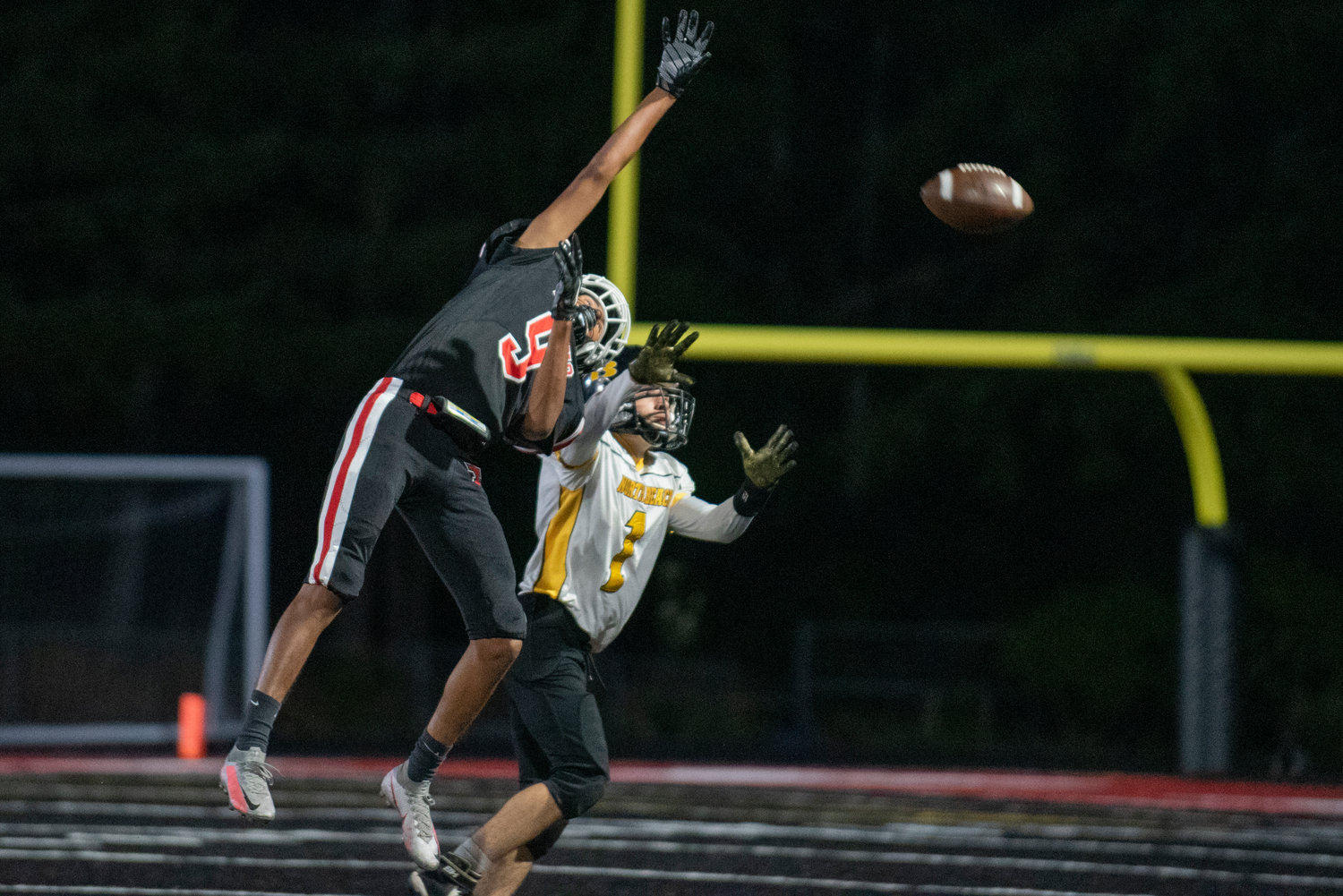 Tenino's Salvador Ontiveros (9) breaks up a pass intended for a North Beach receiver on Friday.
