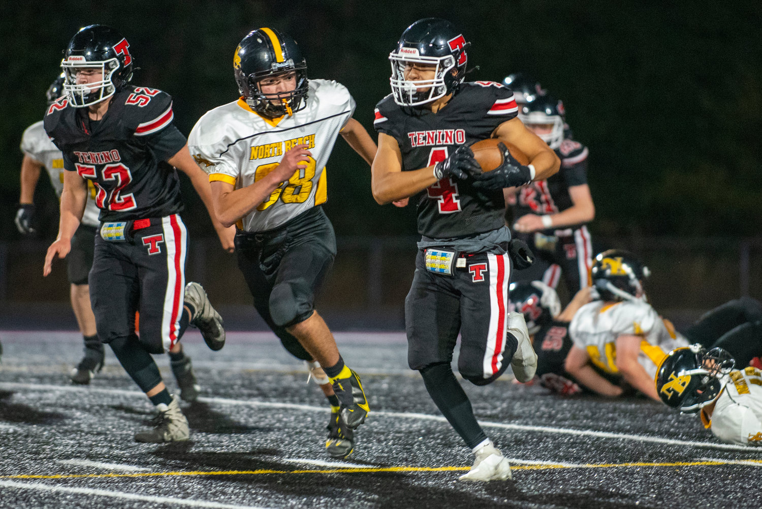 Tenino sophomore halfback Lucas Watterson (4) breaks loose for a long run against North Beach on Friday at home.