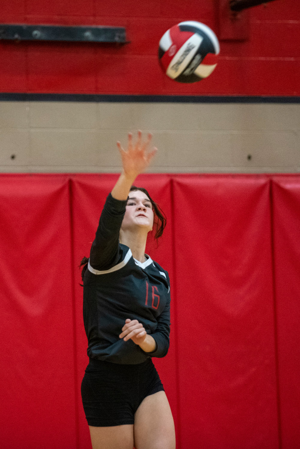 Tenino's Brooke Bratton (16) serves in the Beavers' second set against Aberdeen on Tuesday.