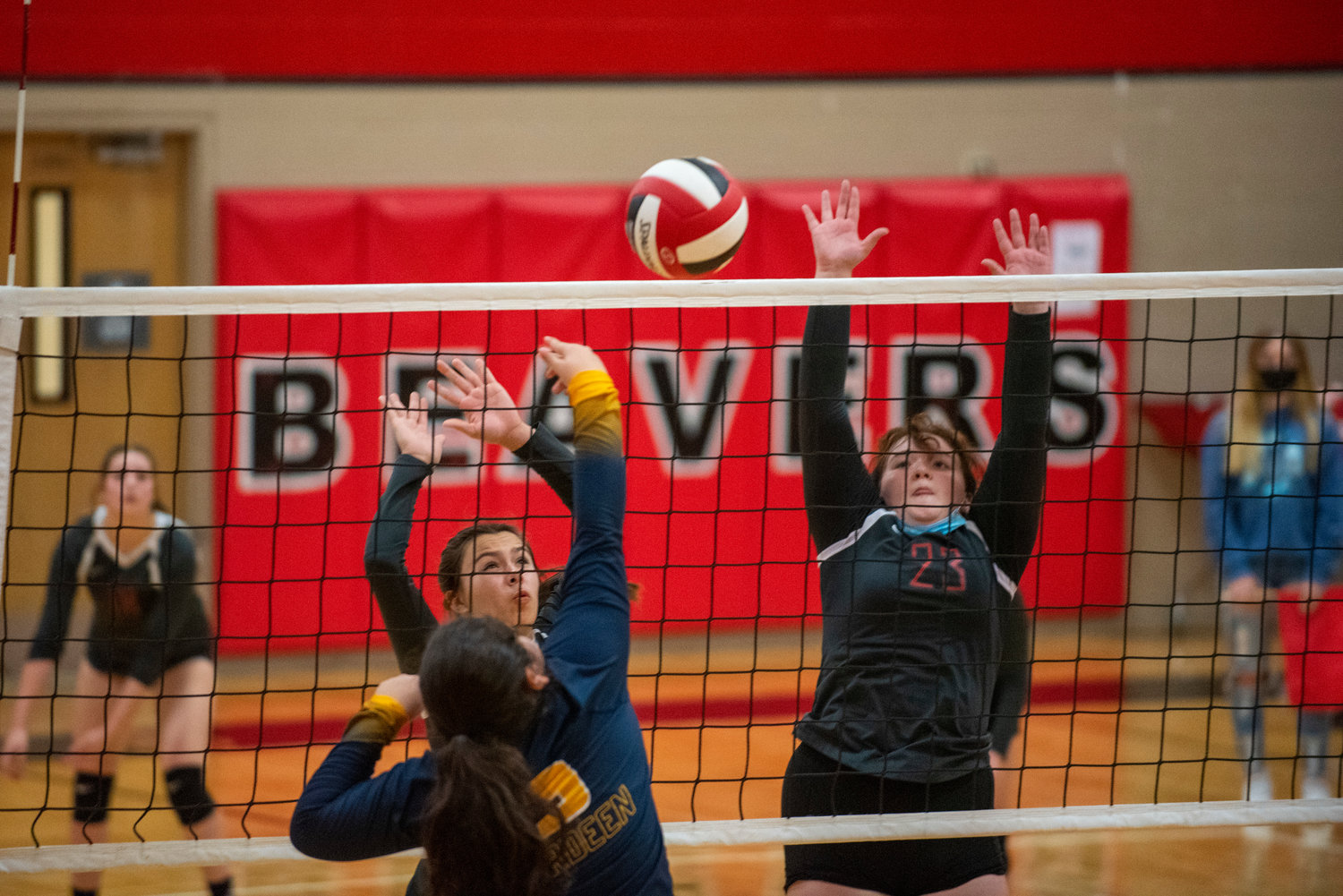 Tenino's Malika Slassi, left, and Raelynn Wilson (23) go for a block against Aberdeen at home on Tuesday.