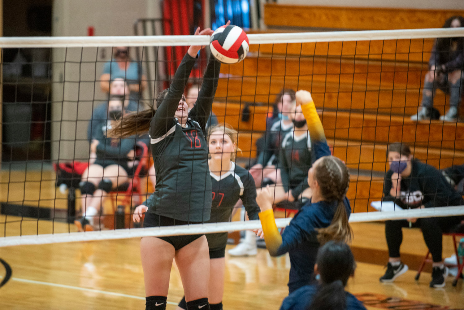 Tenino's Brittany Maynard (18) gets the block on an Aberdeen spike on Monday.