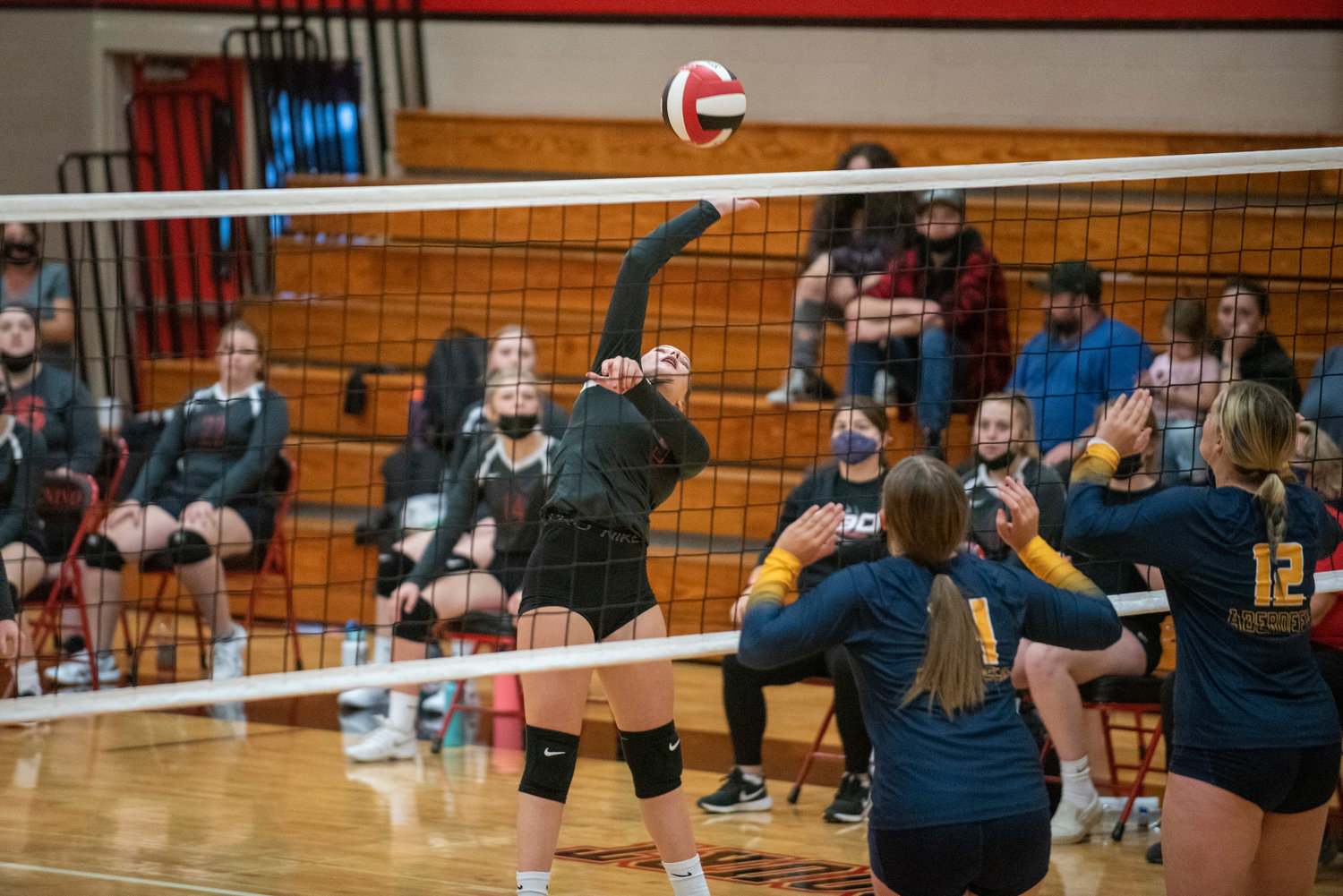 Tenino sophomore Macy Griffis (9) goes up for a spike against Aberdeen on Tuesday.