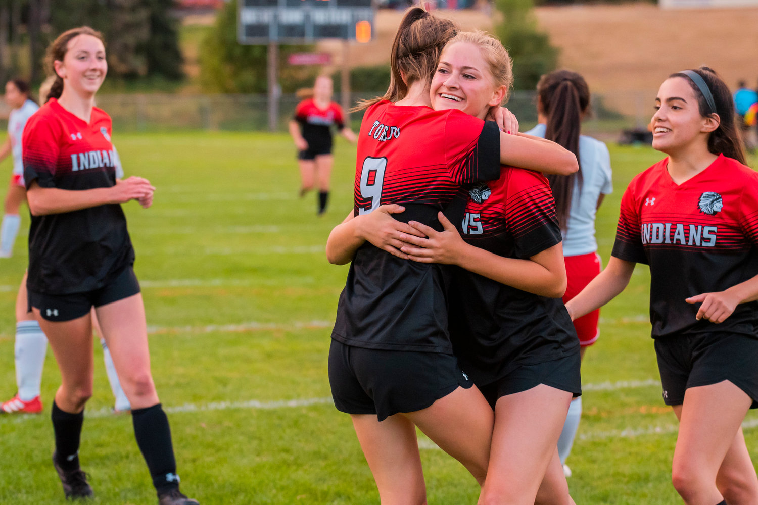 Toledo’s Vanesa Rodriguz (12) smiles and hugs Marina Smith (9) after a goal Tuesday during a game against Hoquiam.