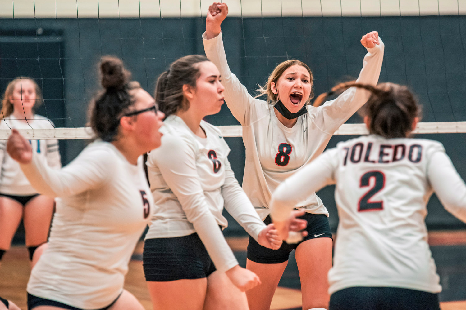 Toledo’s Jordynne Hensley (8) cheers with teammates after a score during a game Tuesday night against Stevenson.