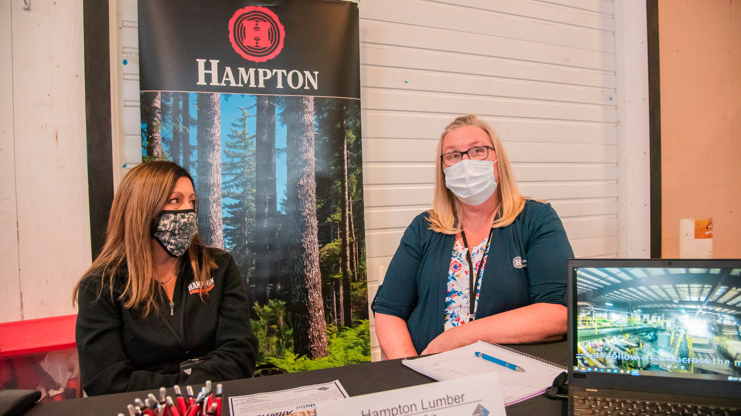 FILE PHOTO — Stacy Wetzel, Human Resources Coordinator with Hampton Lumber Mills, right, talks about job opportunities in Morton, Randle, and Napavine during a Chamber job fair earlier this year.