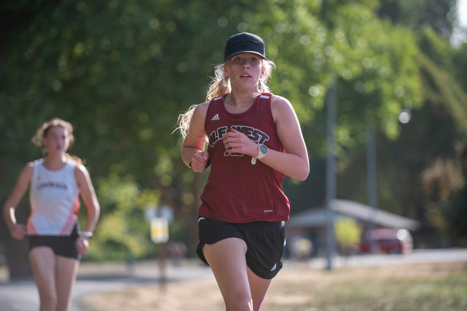 W.F. West's Cadence Edminster runs the opening lap of a dual meet against Centralia at Stan Hedwall Park on Wednesday.