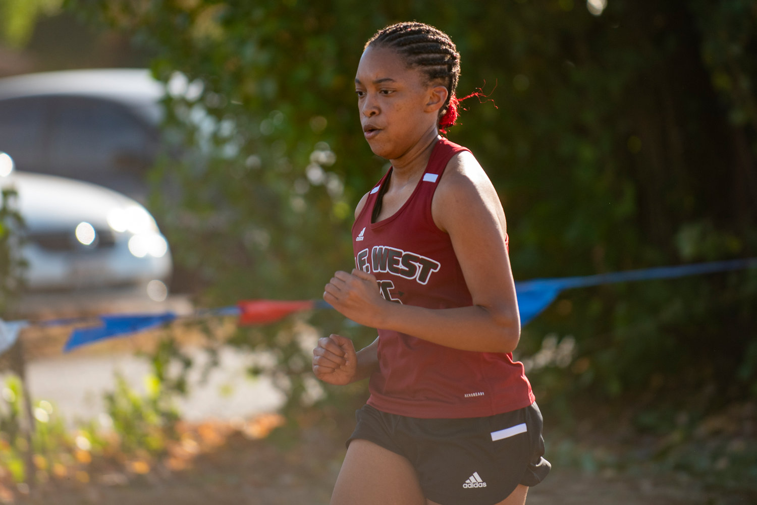 W.F. West's Kaitlin Elmore crosses the finish line on Wednesday.