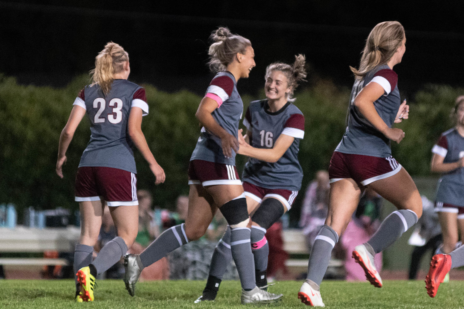 Senior defender Kaylynne Dowling (16) embraces junior Cameron Sheets after a goal in W.F. West's win over Centralia Thursday night.