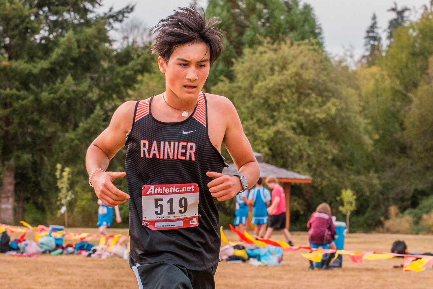 Rainier’s Dylan Davis crosses the finish line during a meet in Onalaska on Thursday.