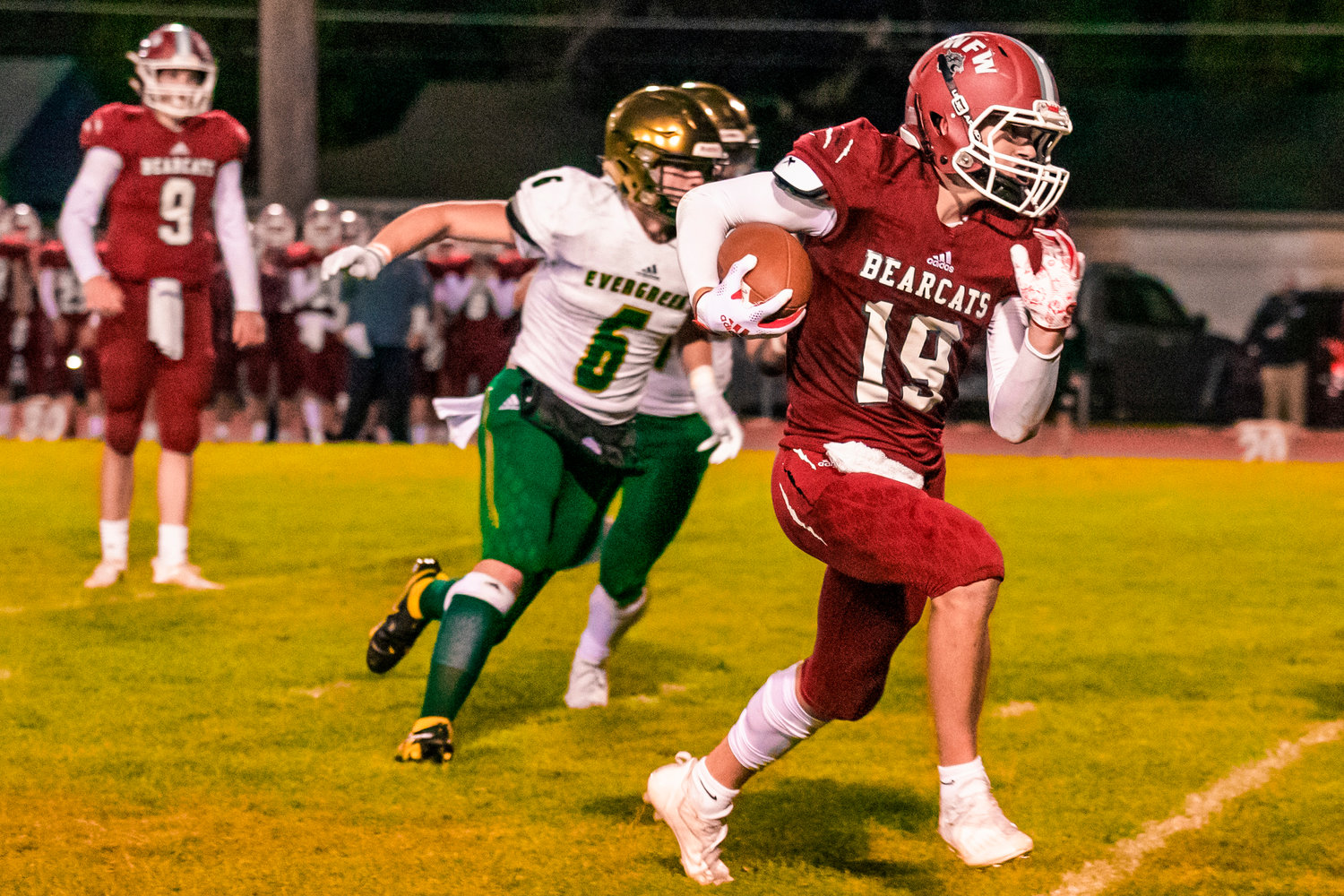 W.F. West’s Gage Brumfield (19) runs past defenders during a game against Evergreen in Chehalis on Friday.