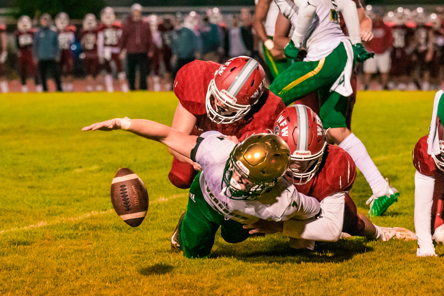 Bearcats force a fumble and take possession during a game against Evergreen Friday night in Chehalis.