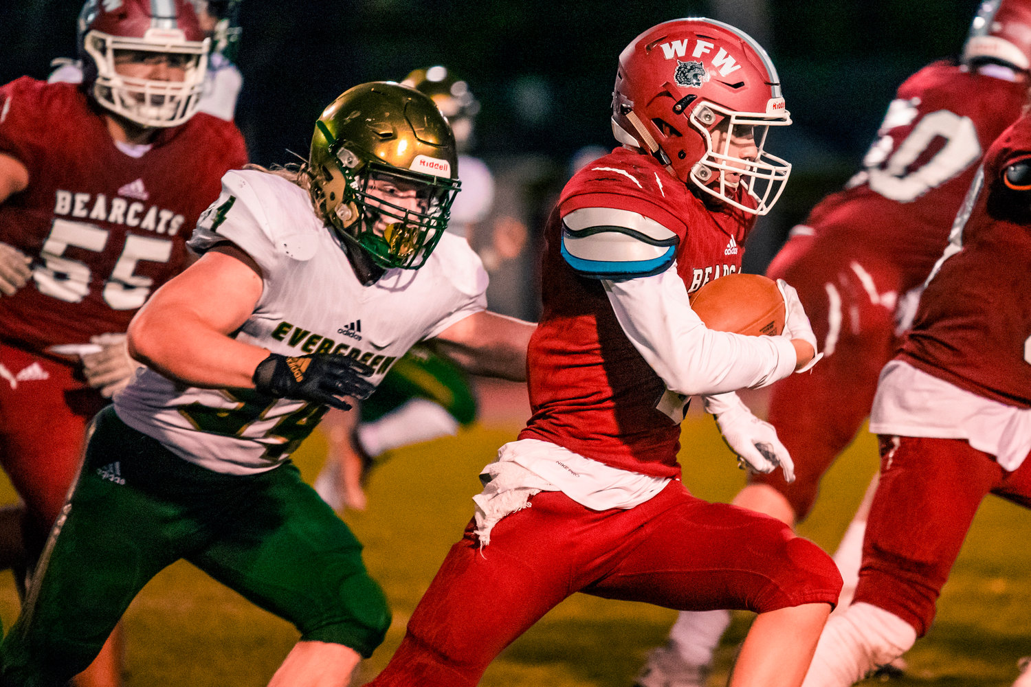 W.F. West’s Jacob Fuller (2) runs with the football during a game against Evergreen at Bearcat Stadium in Chehalis under Friday night lights.