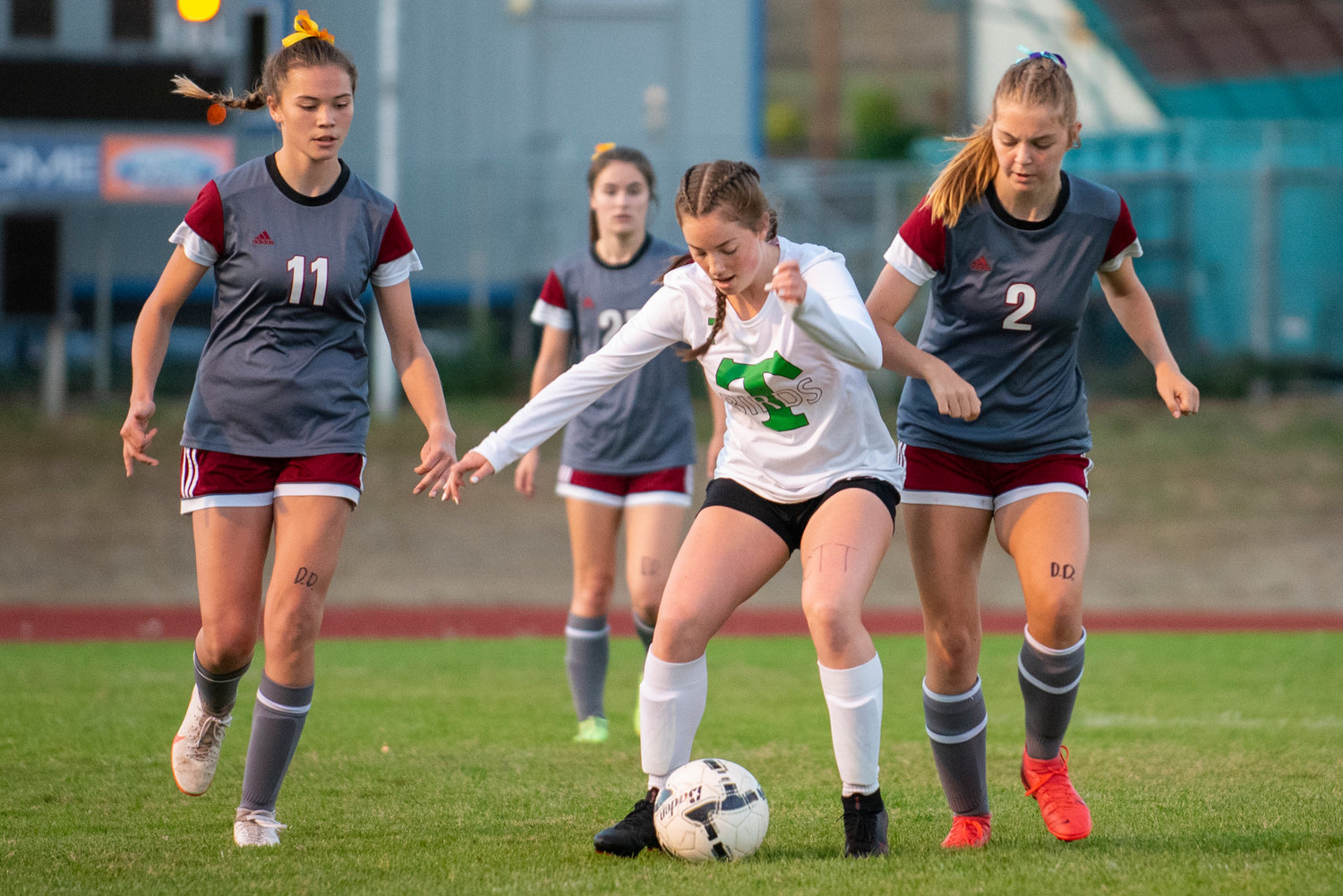 W.F. West's Olivia Remund (11) and Maddy Casper (2) defend against Tumwater's Olivia Kee (7) on Tuesday in Chehalis.