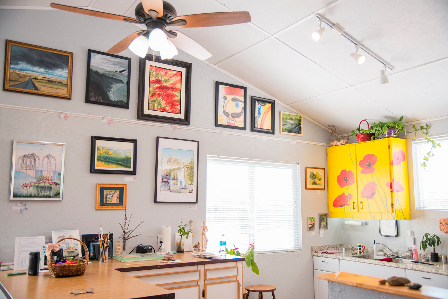 Paintings fill walls and cupboards in Barbara Burres' Cinebar art studio Tuesday afternoon.