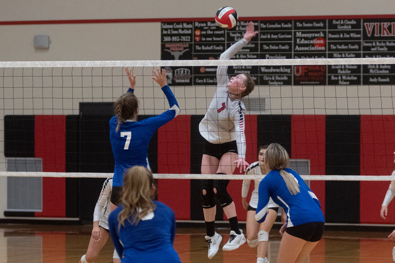 FILE PHOTO -- Junior middle Paige Houghtelling goes up for a spike in Mossyrock's five set loss to Toutle Lake earlier this season.