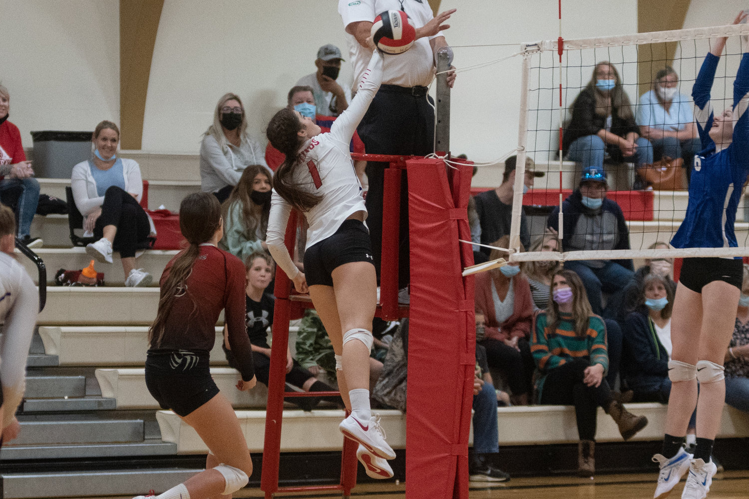 Junior Payton Torrey hits a ball over the net in Mossyrock's five set loss to Toutle Lake Wednesday night.