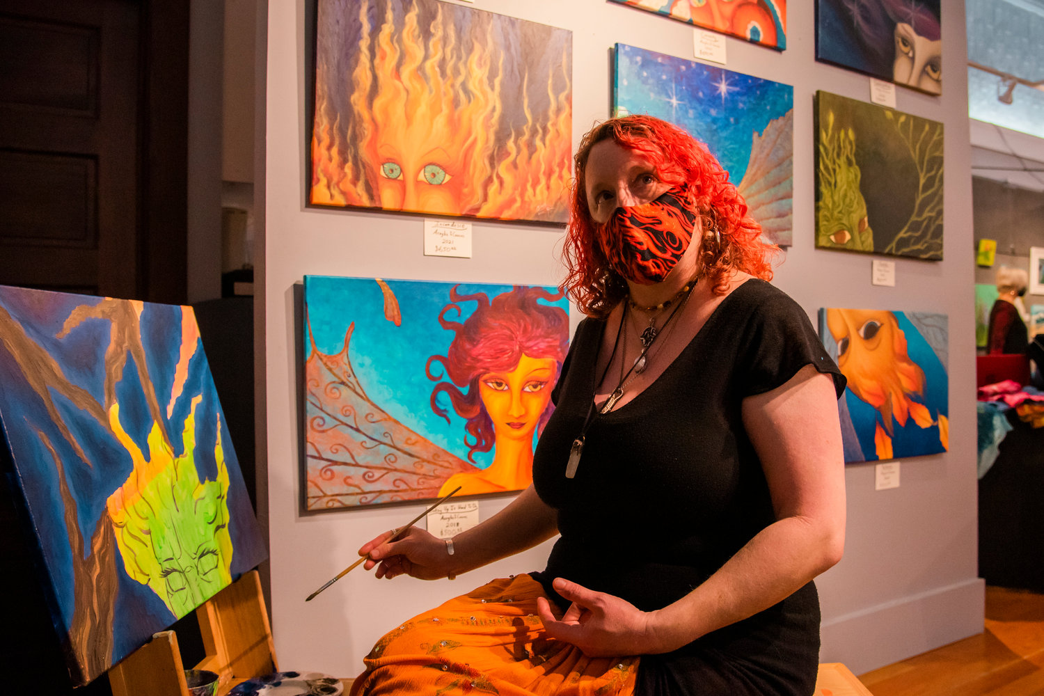 Susan M. Bagrationoff, artist and owner of Art by Lady Z, talks about her banshee painting during an ARTrails Studio Tour at the Rectangle Gallery in Centralia on Saturday.