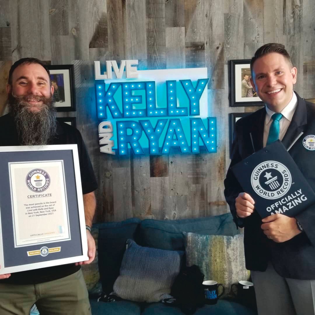 Joel Strasser, left, went on the Kelly and Ryan show last week to break a world record on the amount of pencils one can place into their beard.