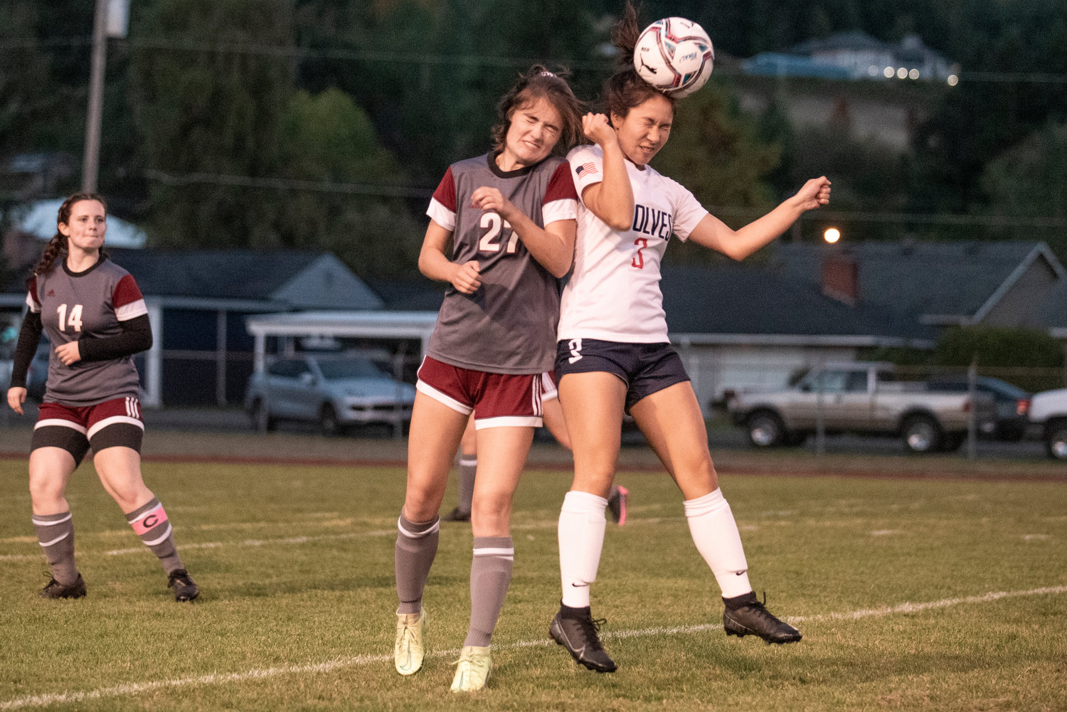 W.F. West's Audrey Toynbee (27) and Black Hills' Janey Do (3) go for a header on Tuesday in Chehalis..