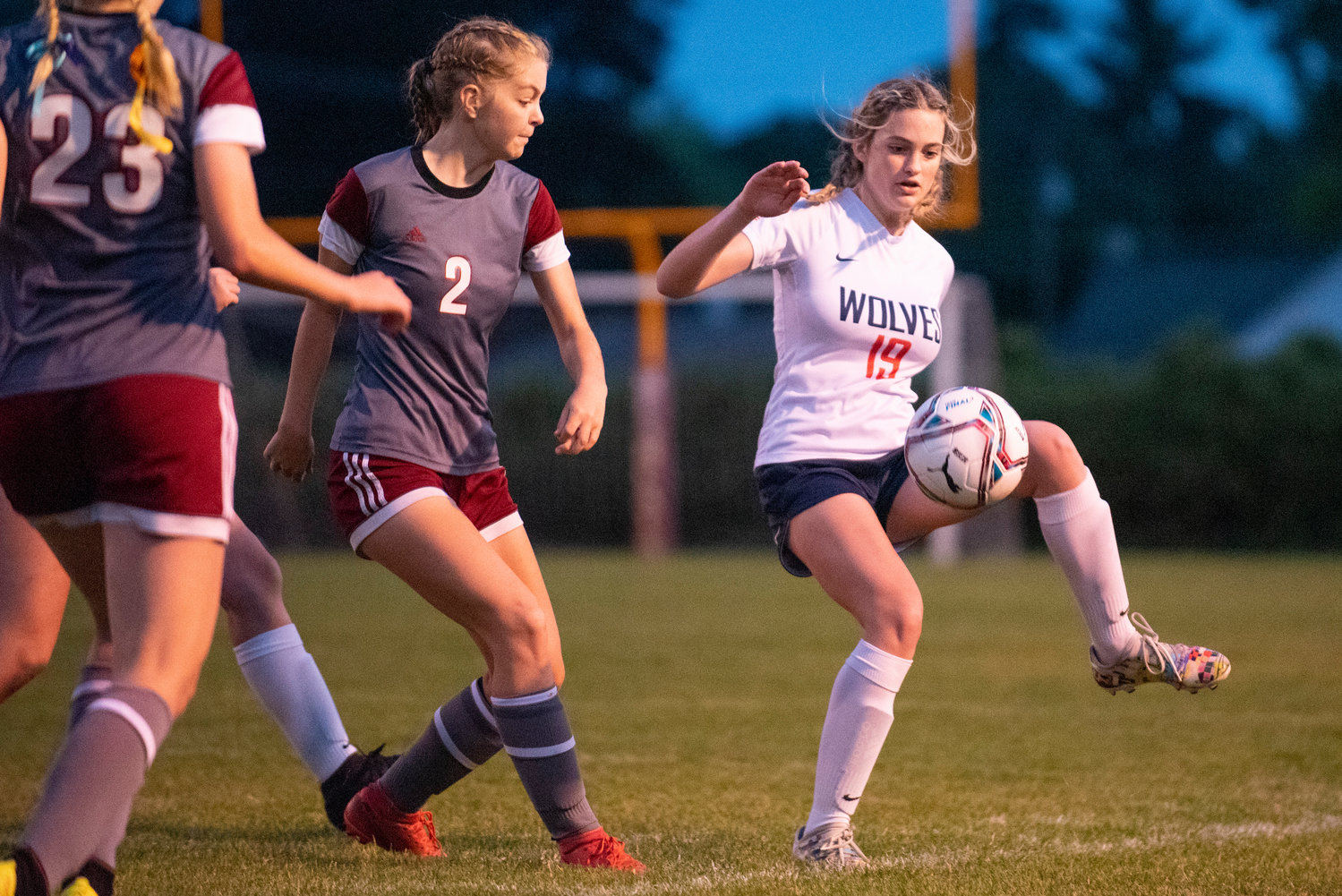 Black Hills' Mackie Finney (19) boots a pass pass W.F. West's Maddy Casper (2) on Tuesday.