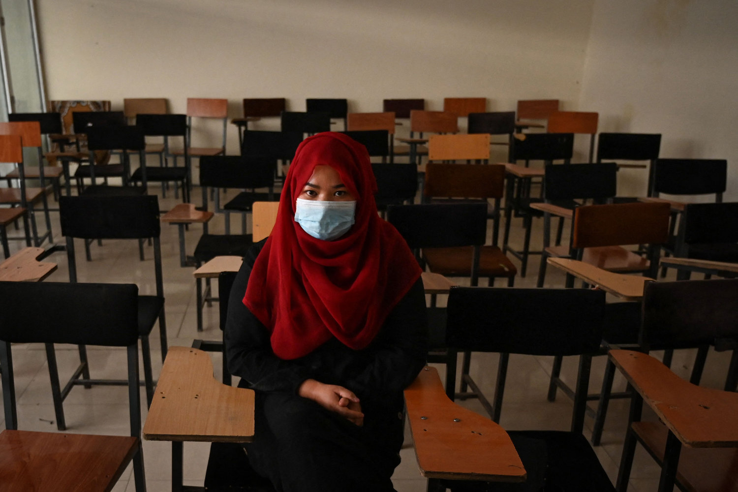 A student sits inside a classroom after private universities reopened in Kabul, Afghanistan, on Sept. 6, 2021. The Taliban said this week that female students won't be able to return to Kabul University until "a real Islamic environment" is provided for all. (Aamir Qureshi/AFP/Getty Images/TNS)