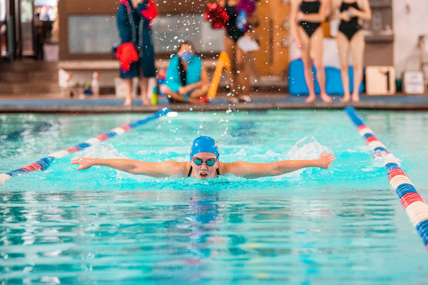 Kiran McElfresh surfaces with a butterfly stroke shortly before entering the water again at the Thorbeckes Pool Thursday afternoon in Centralia.
