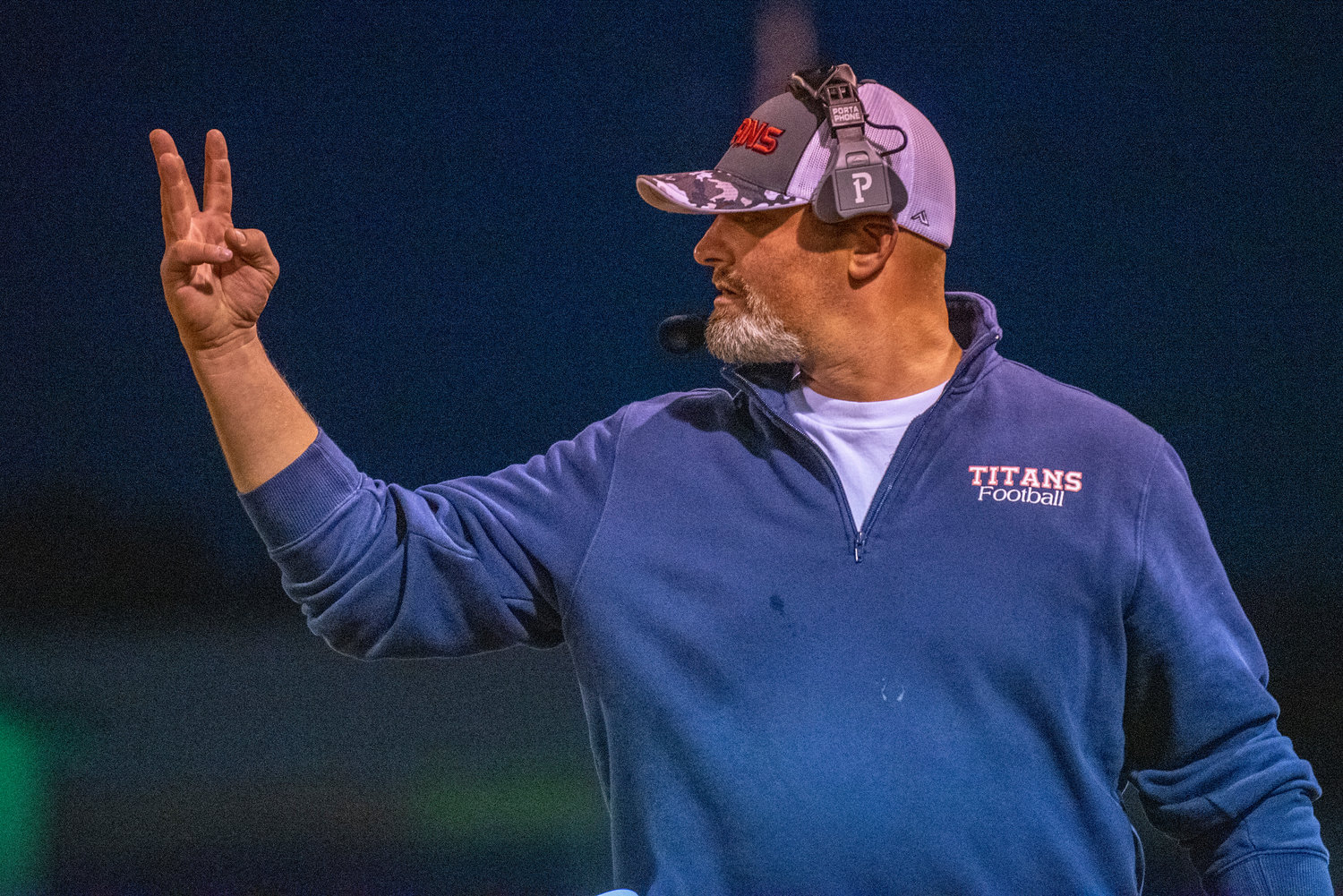 Pe Ell-Willapa Valley head coach Josh Fluke signals his defense during a home game against Morton-White Pass on Friday, Oct. 1, 2021 in Pe Ell.