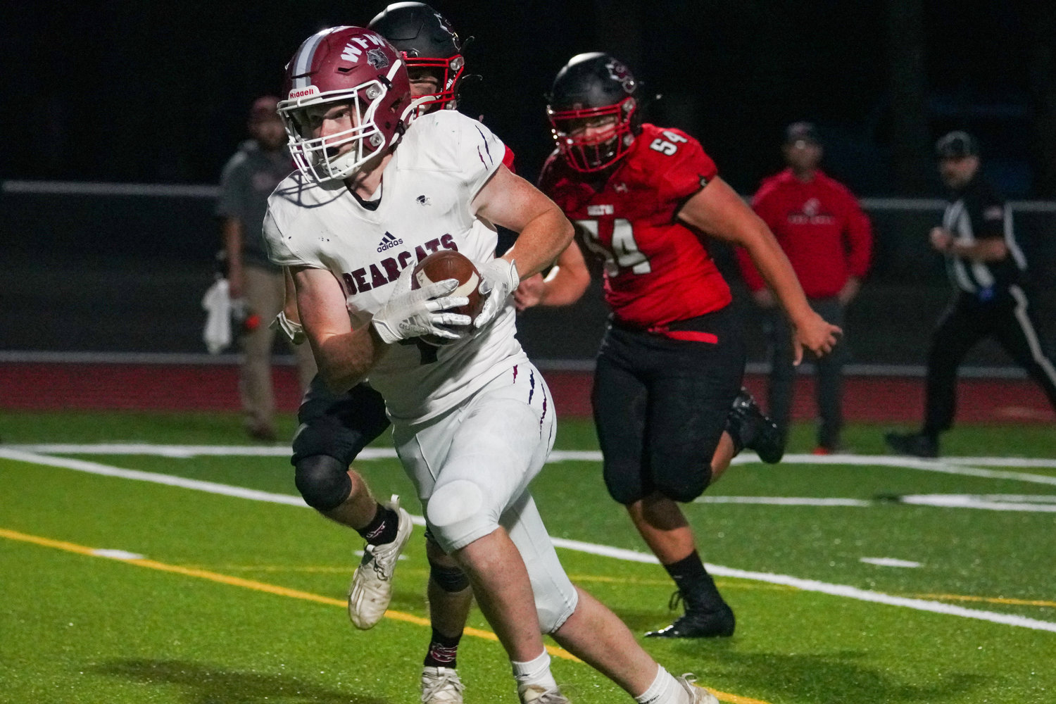 W.F. West's Logan Moore (4) sprints past Shelton defenders on Oct. 1, 2021.