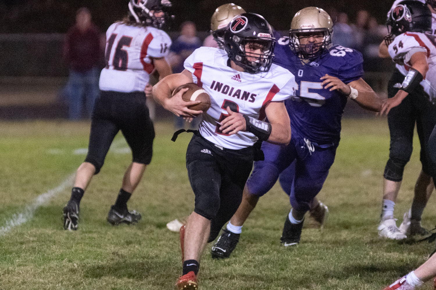 Justin Filla looks for some room to cut upfield in Toledo's 36-6 loss to Onalaska Oct. 1