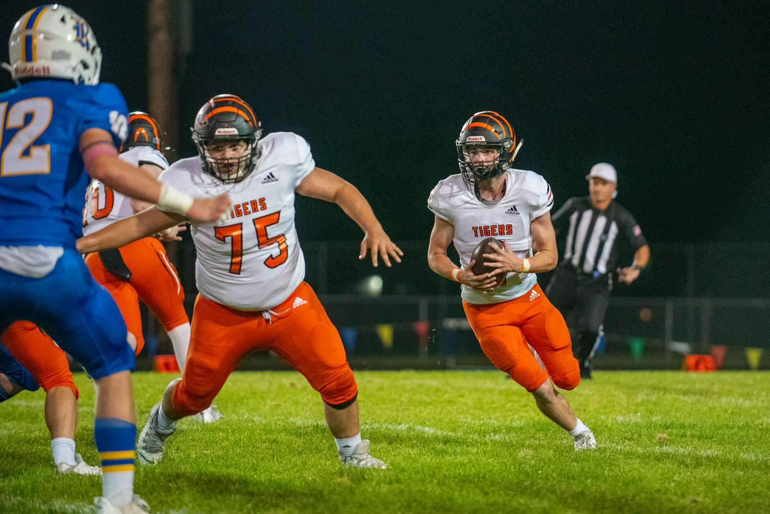 Centralia’s Chase Sobolesky (2) looks for a hole against Rochester’s defense while teammate Sebastian Bustos (75) provides blocking on Oct. 2, 2021.