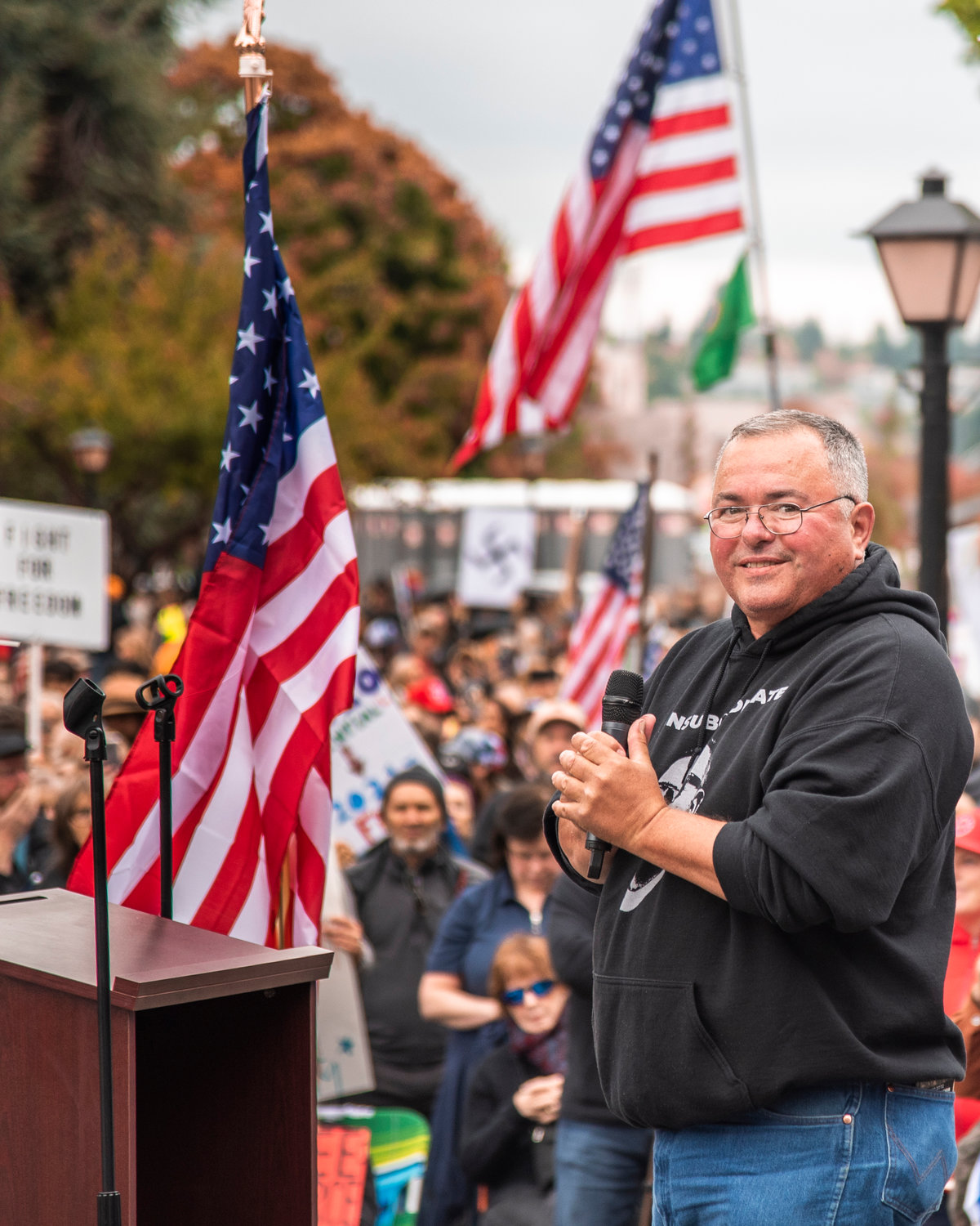 Loren Culp smiles while speaking to crowds during a “Medical Freedom Rally” in Olympia outside the Washington State Capitol Building Sunday afternoon.