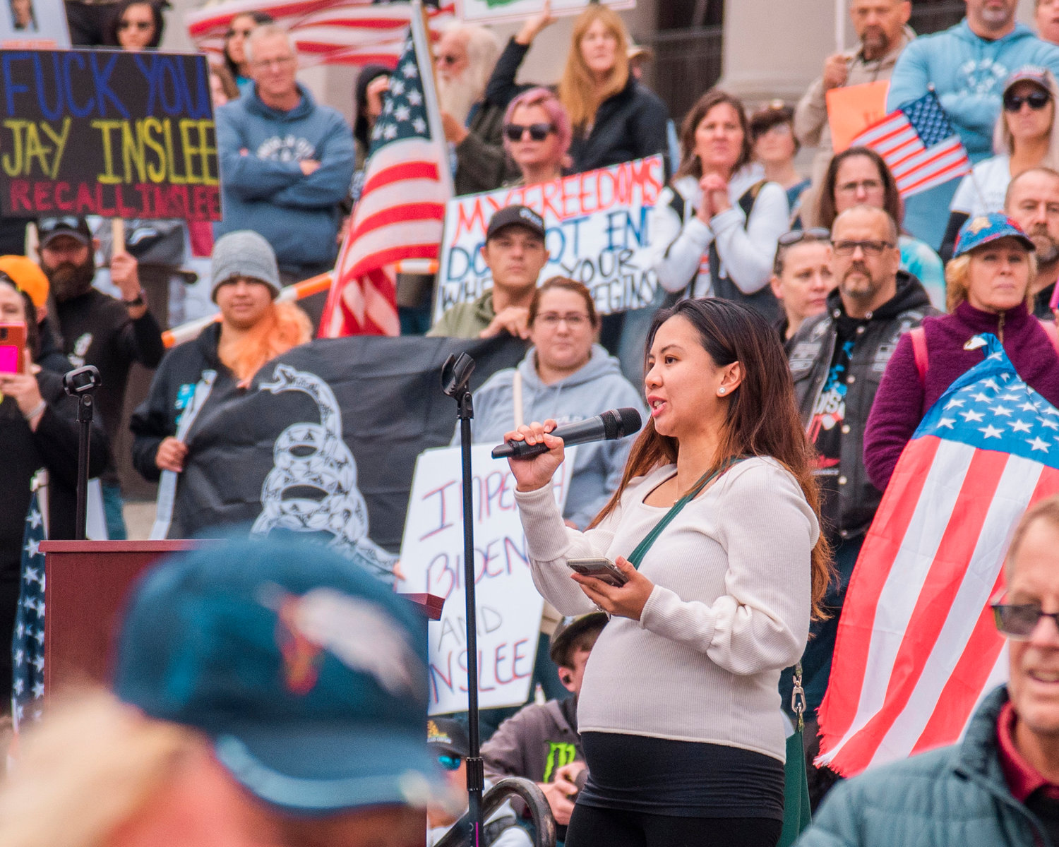 Kristianne Richardson, a pregnant Department of Social and Health Services employee speaks out against forced vaccinations during a “Medical Freedom Rally,” Sunday in Olympia.
