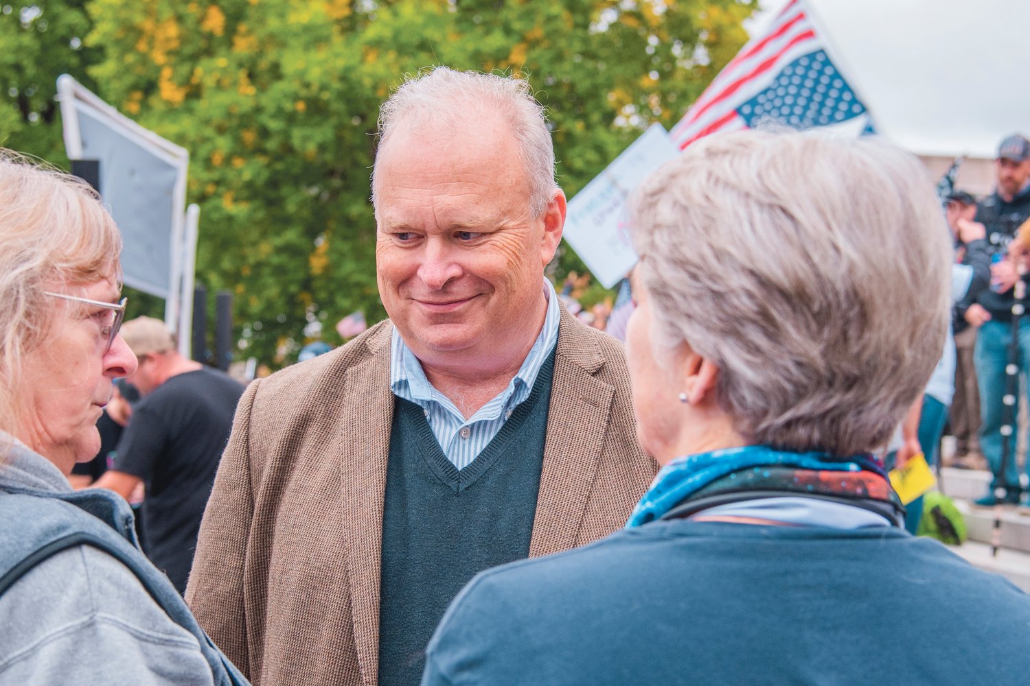 FILE PHOTO — Representative Jim Walsh smiles while mingling with attendees of a “Medical Freedom Rally” outside the Washington State Capitol Building.