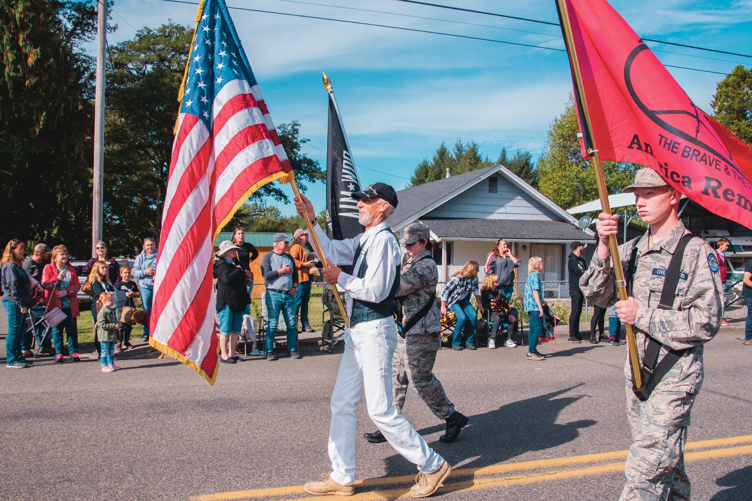 Flags lead the Onalaska Apple Harvest parade Saturday morning.