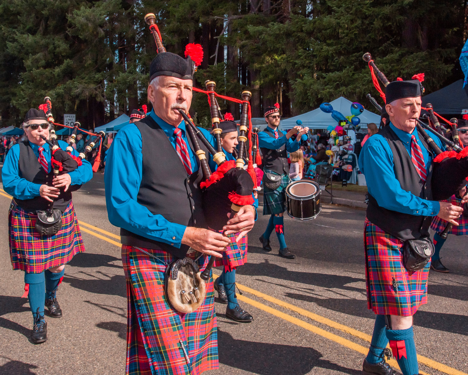 Bagpipers and other musicians make their way through Onalaska during a parade Saturday morning.