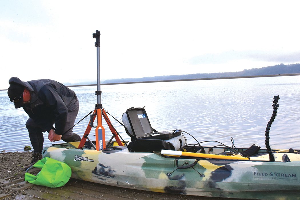Mapper Brian Footen sets up his equipment as he prepares to map the Nisqually Delta nearshore.