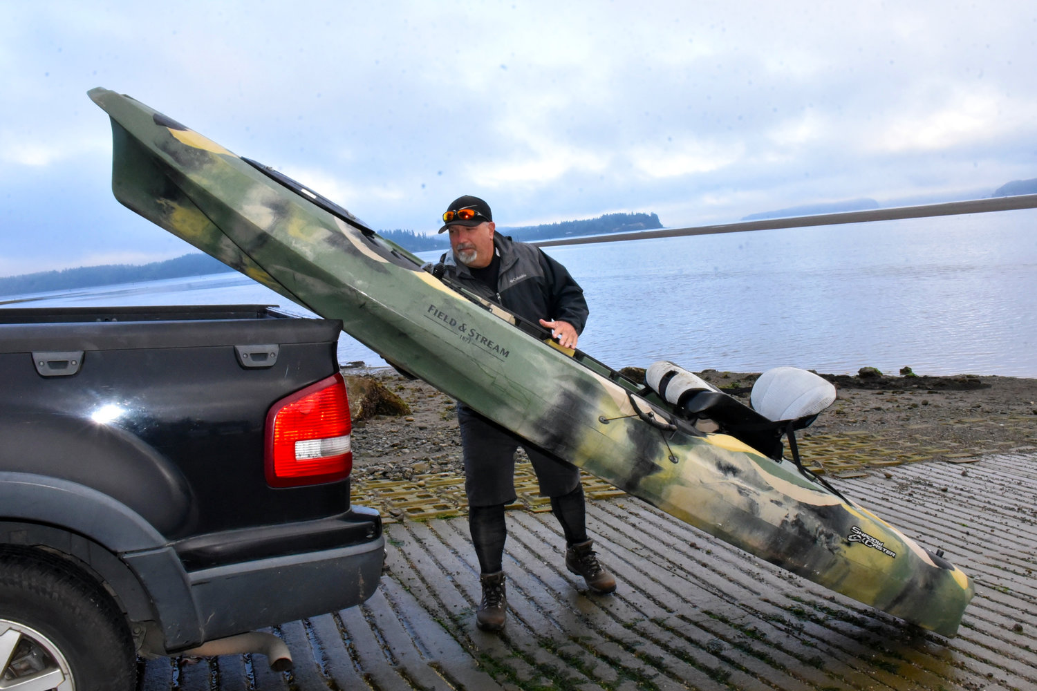 Mapper Brian Footen unloads his kayak as he prepares to map the Nisqually delta nearshore.