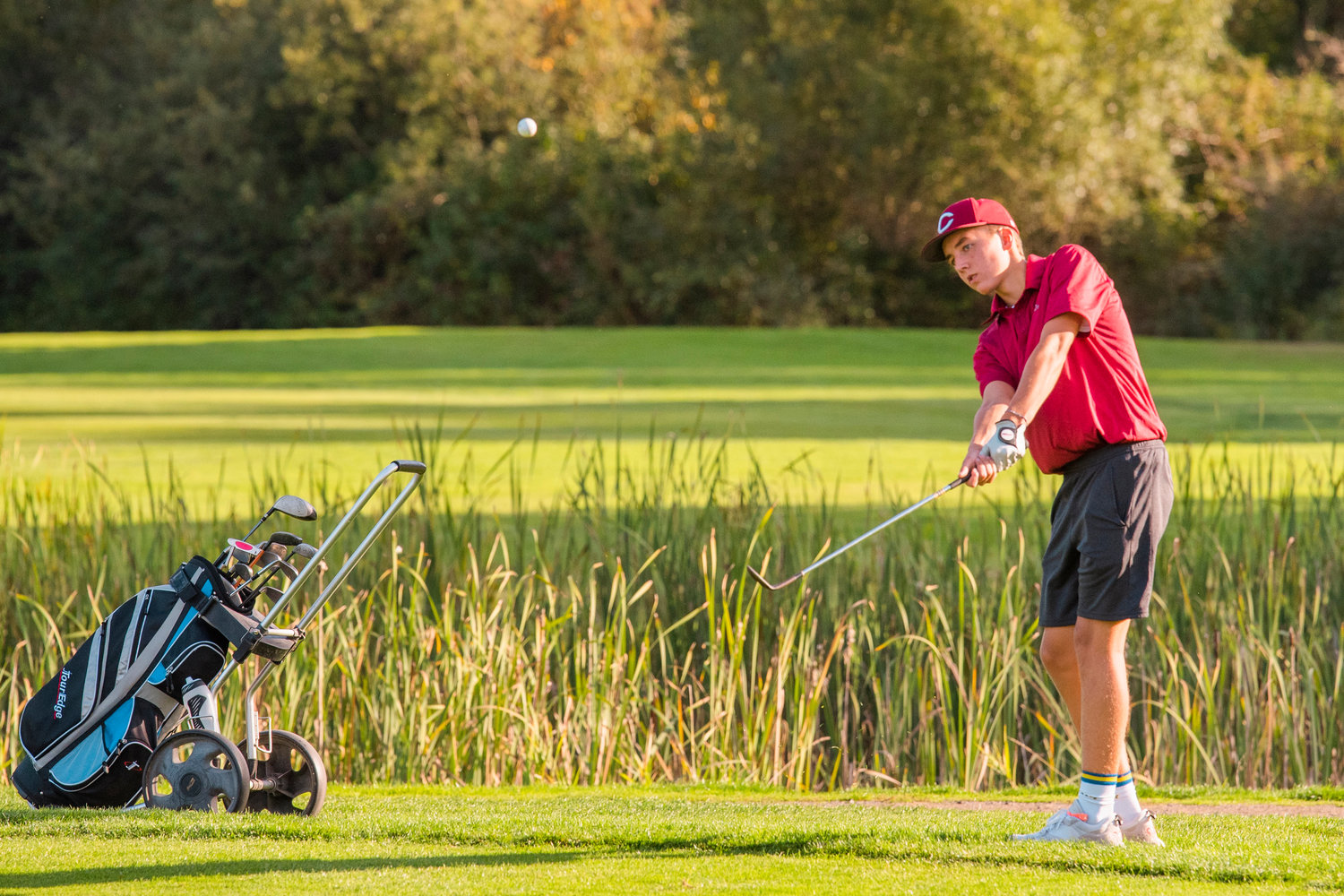 W.F. West’s Weston Potter hits a ball up while golfing in Chehalis on Monday at the Newaukum Valley Golf Course.