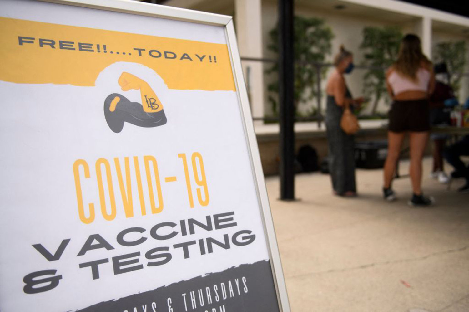 Free COVID-19 vaccine and testing signage is displayed during a City of Long Beach Public Health COVID-19 mobile vaccination clinic at the California State University Long Beach (CSULB) campus on Au. 11, 2021 in Long Beach, California. (Patrick T. Fallon/AFP via Getty Images/TNS)