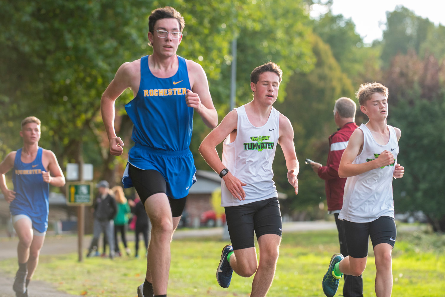 Rochester's William Morton, second from left, competes in a three-team meet at Stan Hedwall Park on Wednesday, Oct. 6, 2021.