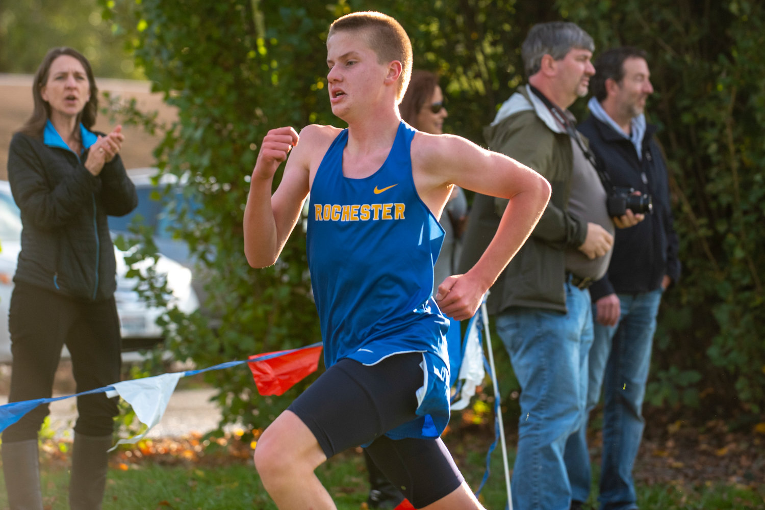 Rochester's Gunnar Morgan crosses the finish line at a three-team meet at Stan Hedwall Park on Wednesday, Oct. 6, 2021.
