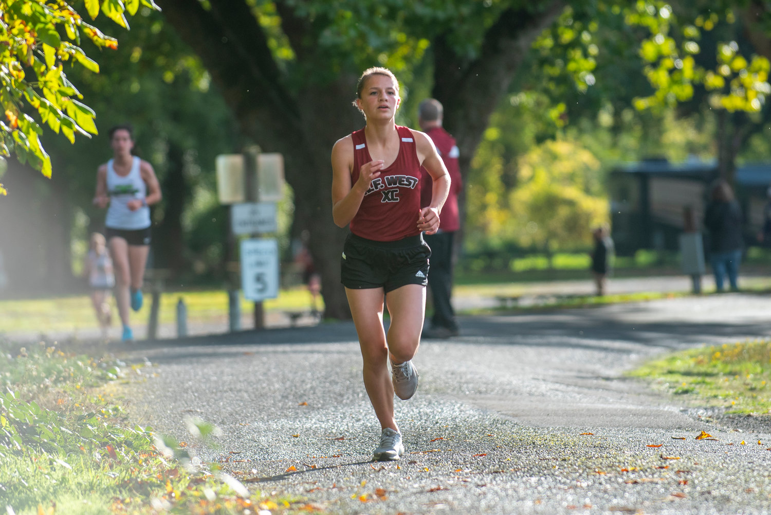 W.F. West freshman Mercedes Ricks runs the opening lap of a dual cross country meet at Stan Hedwall Park on Wednesday, Oct. 6, 2021.