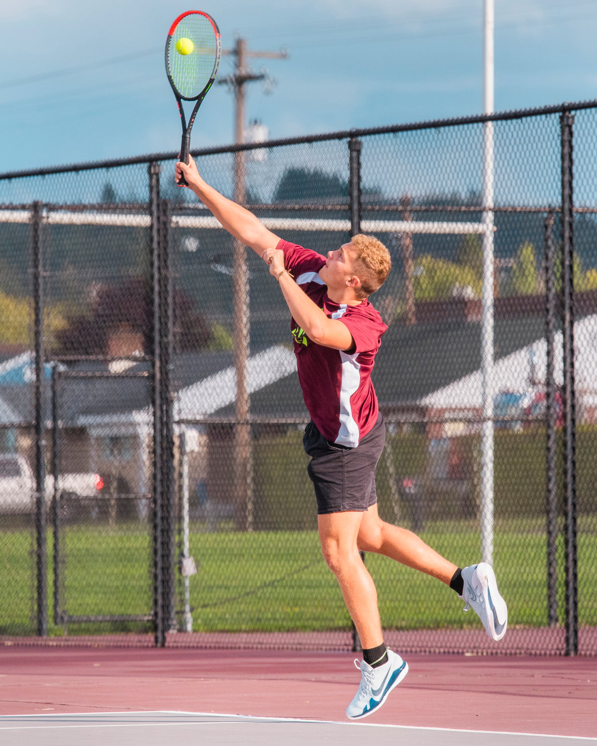 W.F. West’s Hans Meier serves the ball during a match in Chehalis Wednesday afternoon.