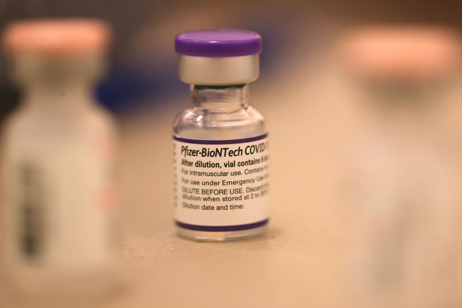 A vial of Pfizer COVID-19 booster vaccination sits on a table at a vaccination booster shot clinic on Oct. 1, 2021 in San Rafael, California. (Justin Sullivan/Getty Images/TNS)