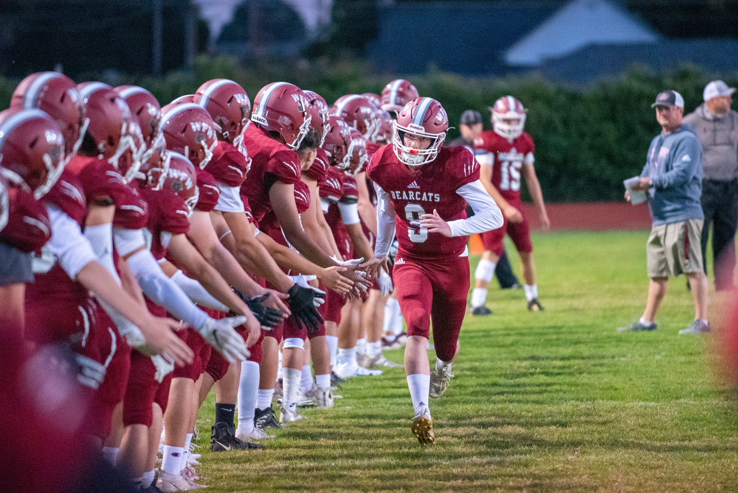 W.F. West quarterback Gavin Fugate (9) sprints down the sideline during pregame announcements during a home game against Rochester on Oct. 8, 2021.