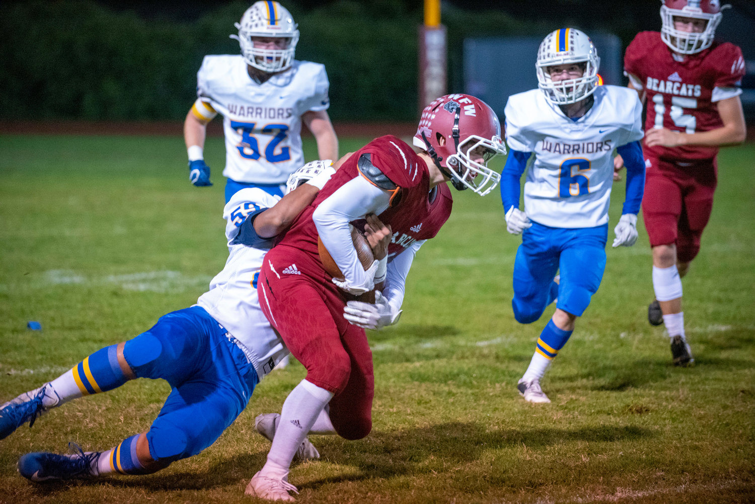 W.F. West's Cameron Amoroso (11) gets brought down by Rochester's Tyren Rodela (59) on a punt return on Oct. 8. 2021.
